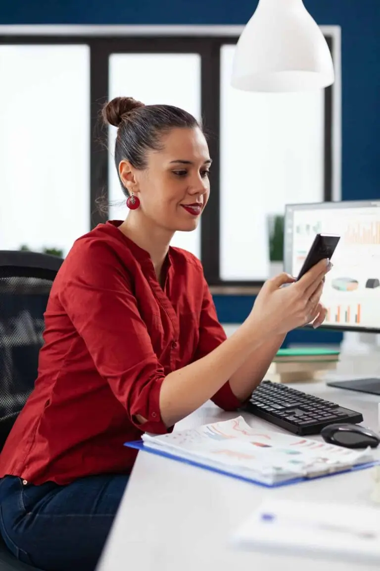 manager-using-smartphone-in-startup-business-office.jpg